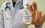 Infectious doctor show COVID 19 vaccine for prevention,immunization and treatment for new corona virus infection(COVID-19,novel coronavirus disease 2019 or nCoV 2019 from Wuhan). Medical technology.