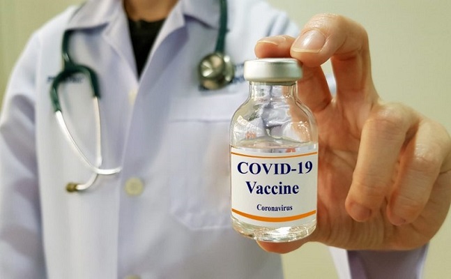 Infectious doctor show COVID 19 vaccine for prevention,immunization and treatment for new corona virus infection(COVID-19,novel coronavirus disease 2019 or nCoV 2019 from Wuhan). Medical technology.